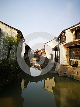 Ancient building reflecting on the peaceful river