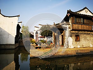 Ancient building reflecting on the peaceful river