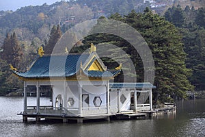 Ancient buildings by the mountain and lake