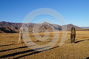 Ancient burial mounds at Karakol valley Uch-Enmek park in Alt