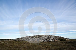 An ancient burial place with a heap of stones