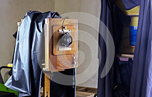 Ancient camera with a wooden folding corps