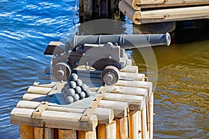 Ancient cannon with stacked cannon balls