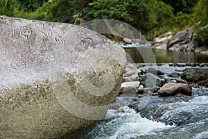 Ancient carved figures on stones in Jayuya Puerto Rico photo