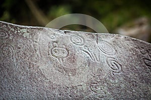 Ancient carved figures on stones in Jayuya Puerto Rico photo