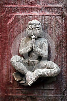 Ancient carved wooden figure at Shwe Nan Daw Kyaung, Myanmar