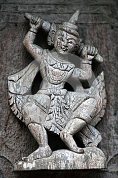 Ancient carved wooden figure at Shwe Nan Daw Kyaung, Myanmar