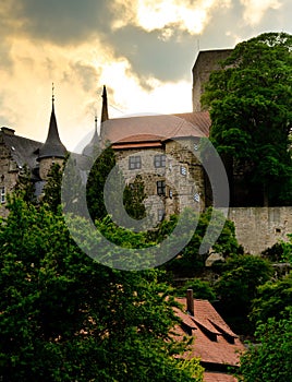 The ancient castle Adelebsen Burg Adelebsen in the middle of Germany, Europe with beautiful sky and clouds and backlight