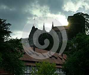 The ancient castle Adelebsen Burg Adelebsen in the middle of Germany, Europe with beautiful sky and clouds and backlight