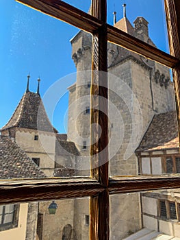 Ancient castle in Agle Switzerlandswit in the window