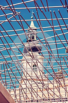 Ancient castle behind forged grid, Nitra, red filter