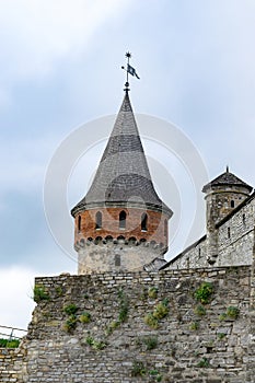 Ancient castle defensive tower and moss covered walls. Kamianets-Podilskyi, Ukraine