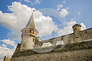 Ancient castle fort tower ancient heritage historical building sightseeing site foreshortening on stone wall from below with blue