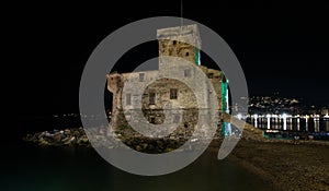 The ancient castle on the sea by night, Rapallo, Ligurian riviera, Genoa province, Italy