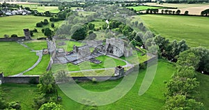 An ancient castle set against a backdrop of green dales in Ireland Kells Priory