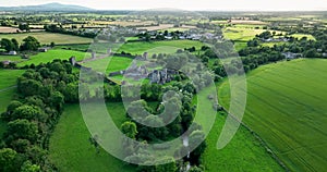 An ancient castle set against a backdrop of green dales in Ireland Kells Priory