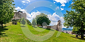 Ancient castle Trencin, Slovakia. Old fort on the hill, big walls and towers. Summer day, dramatic clouds before storm