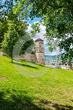 Ancient castle Trencin, Slovakia. Old fort on the hill, big walls and towers. Summer day, dramatic clouds before storm