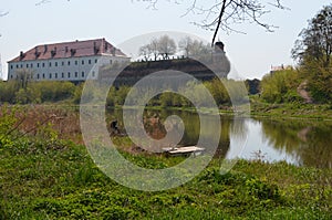 Ancient castle with a viewing tower near the river.