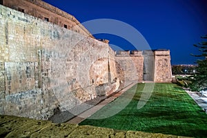 Ancient castle walls of La Valletta at night, Malta