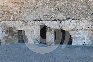 Ancient cave houses at the base of the medieval castle of Arab origin of Atalaya. Villena, Alicante, Spain