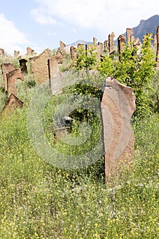 ancient cemetery of highlander warriors with gravestones in the form of saber hilts on the mountain in Dagestan, Russia