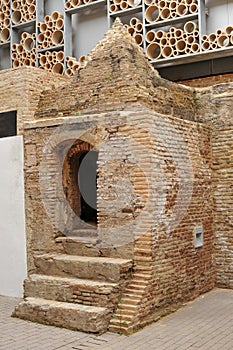 Ancient ceramic muffle furnace in an old factory for tiles production, Seville, Spain photo