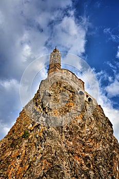 Ancient Chapel Saint Michel de Aiguilhe standing at a very steep volcanic needle Le Puy en Velay, France