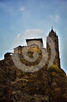 Ancient Chapel Saint Michel de Aiguilhe standing at a very steep volcanic needle Le Puy en Velay, France