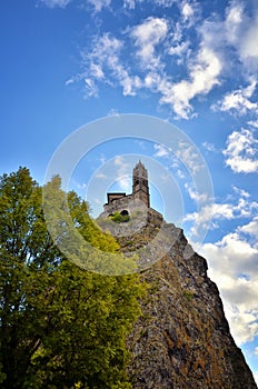 Ancient Chapel Saint Michel de Aiguilhe standing at a very steep volcanic needle Le Puy en Velay, France