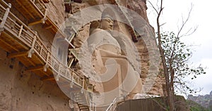 Ancient Chinese Buddha Statue at Bingling Cave Temple in Gansu China. UNESCO World heritage site