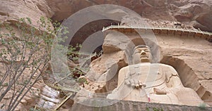 Ancient Chinese Buddha Statue at Bingling Cave Temple in Gansu China. UNESCO World heritage site