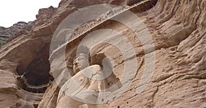 Ancient Chinese Buddha Statue at Bingling Cave Temple in Gansu China. UNESCO World heritage site