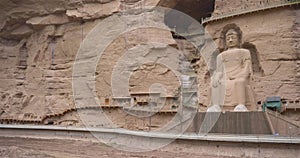 Ancient Chinese Buddha Statue at Bingling Cave Temple in Gansu China. UNESCO World heritage site