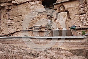 Ancient Chinese Buddha Statue at Bingling Cave Temple in Lanzhou Gansu China. UNESCO World heritage site