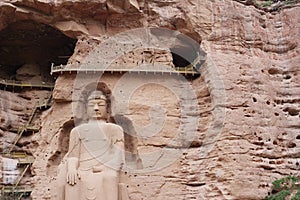 Ancient Chinese Buddha Statue at Bingling Cave Temple in Lanzhou Gansu China. UNESCO World heritage site