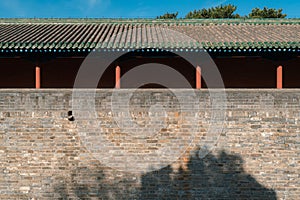 Ancient Chinese building city brick wall with red walls and pillars, in the Temple of Heaven in Beijing, China