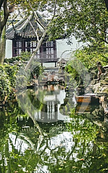 Ancient Chinese Pagoda Boat Water Reflection Garden of the Humble Administrator Suzhou China