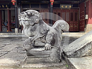 Ancient Chinese stone lion sculpture is a traditional art