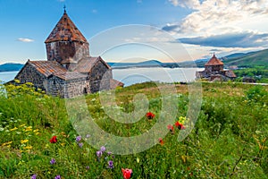 Ancient Christian monastery of Sevanavank and Lake Sevan at sunset