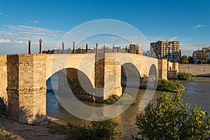 The ancient church Basilica del Pillar and bridge near the river Ebro in the Spanish city Zaragoza