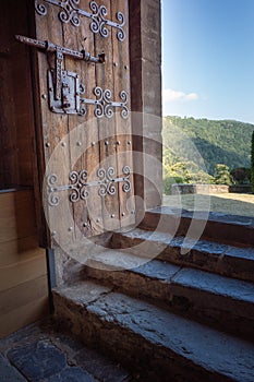 Ancient church door in Pobla de Lillet village photo