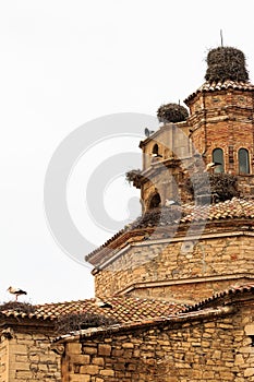 Ancient church of Seros covered with stork nests in Spain