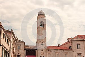 Ancient church top view, and stairs of Dubrovnik old town, hand made walls build with old bricks and stones, clock tower, bell tow