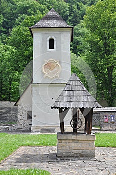 Ancient church and well in Cerveny Klastor