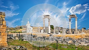 Ancient city of Hierapolis with statue of Pluto and columns in Pamukkale