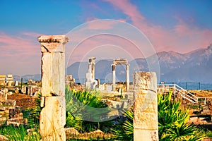 Ancient city of Hierapolis and a statue of Pluto or Hades at dawn