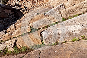 Ancient city of Syedra, Turkey. Slanted low angle view of ruined historic stone stairs. Selective focus