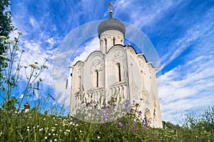 Church of the Intercession of the Holy Virgin on the Nerl River on the bright summer day.