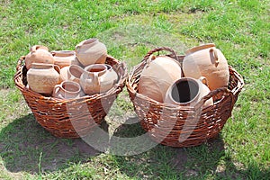 Ancient clay pots in basket